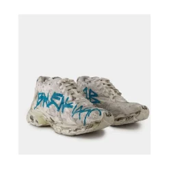 Białe syntetyczne buty do biegania